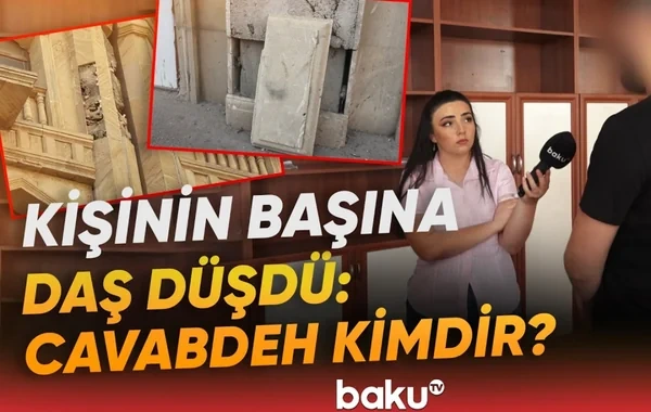 Ticarət mərkəzinin yanından keçən kişinin üzərinə daş düşdü: Problemi kim həll etməlidir? - VİDEO