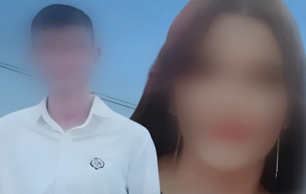 Qardaşı övladlarını baltalamaqda ittiham edilən əminin fotosu