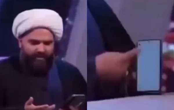 İranda efirdə mesaj oxuyan molla biabır oldu - VİDEO