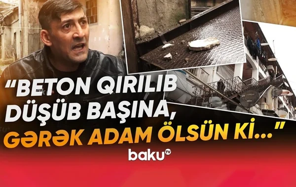 Təhlükə saçan binanın sakinləri özlərindən çıxdılar: "Başımıza daş tökülür" - VİDEO